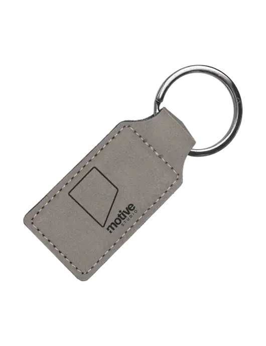 Grey Laserable Leatherette Rectangle Keychain w/Motive Studio Logo